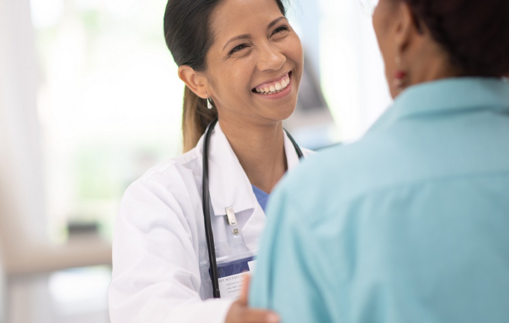 Photo of health care provider talking with patient