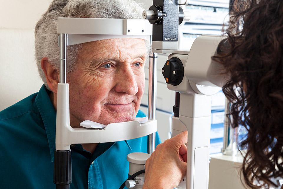 Older man at an eye exam