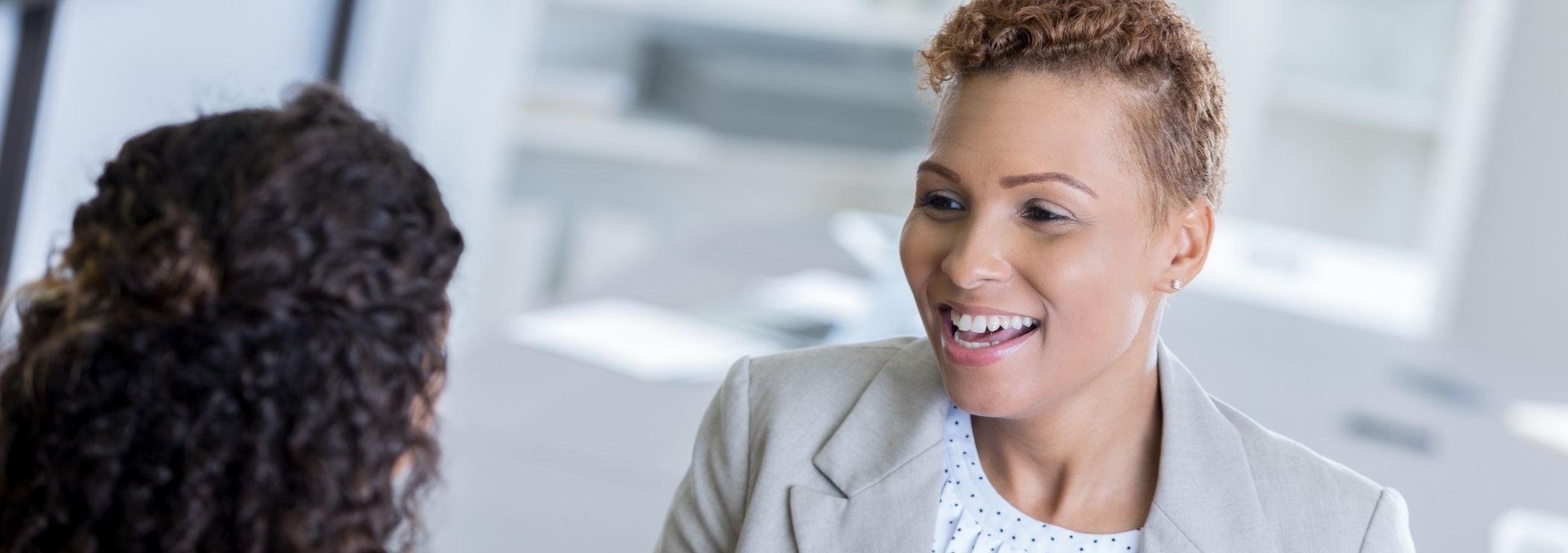 Smiling case manager talking with patient.