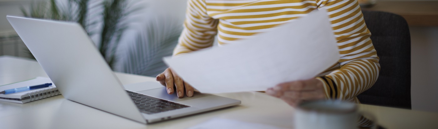 Woman looking at tax forms