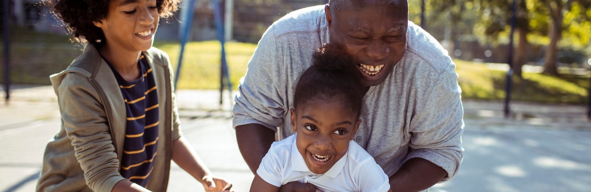 Grandad playing with kids.