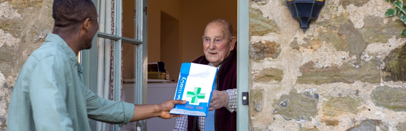 Photo of man receiving prescriptions by mail