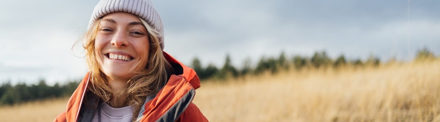 Young woman hiking on a late fall day.