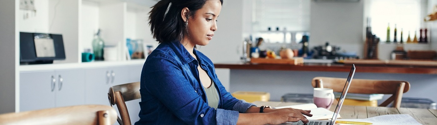Photo of woman paying bills online
