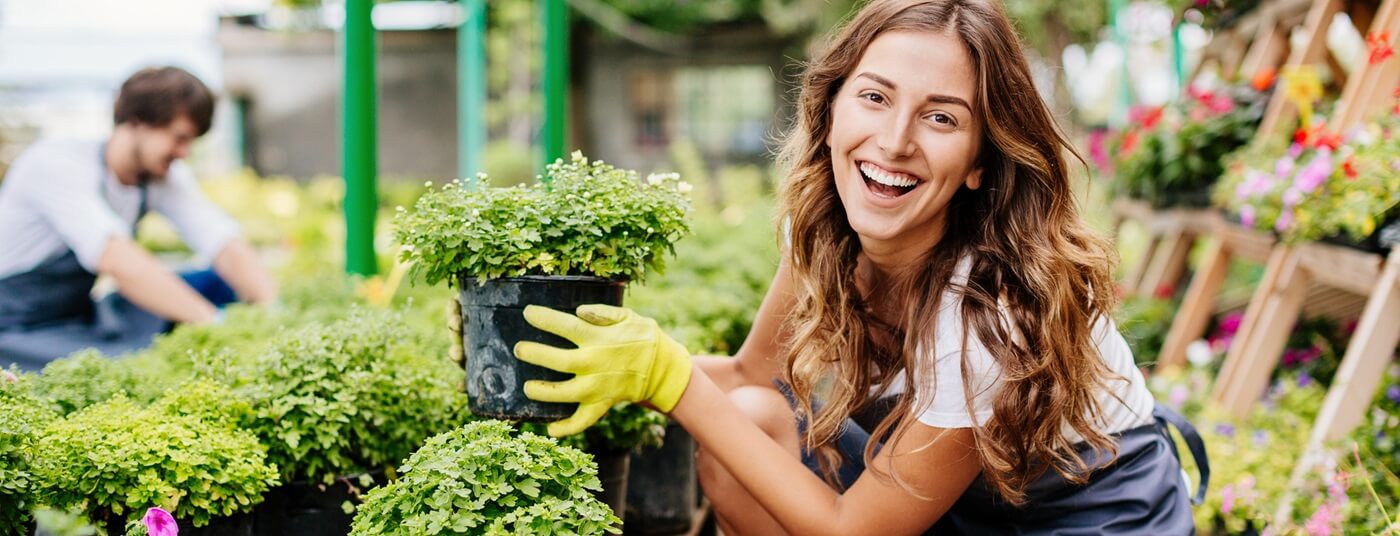 Young woman working at garden center