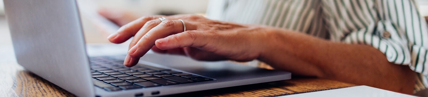 Senior typing on laptop