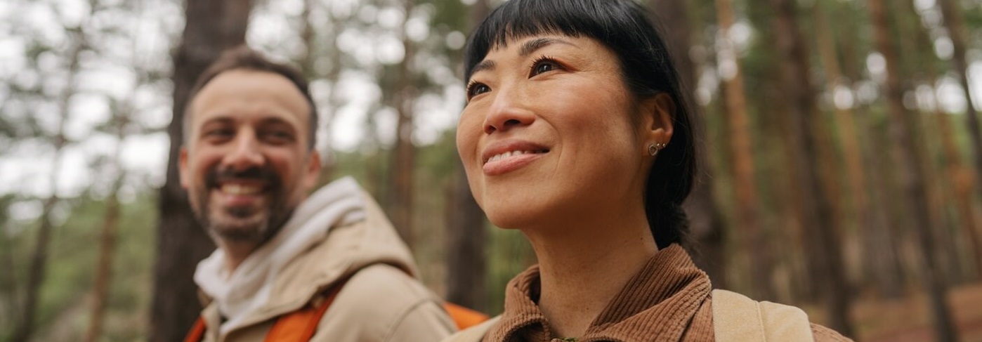 Two adult hikers in the woods