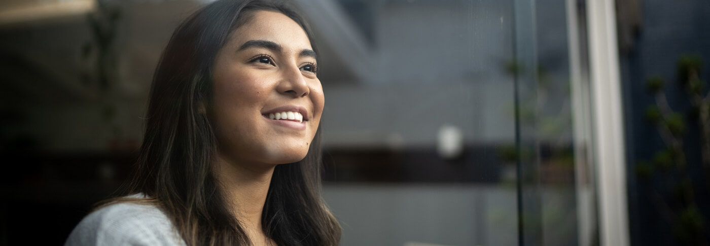 Young woman smiling.