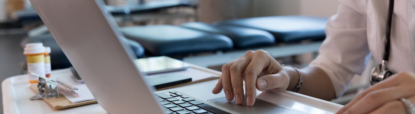 Photo of provider using laptop.