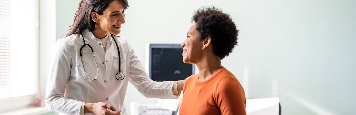 Woman talking with her doctor.