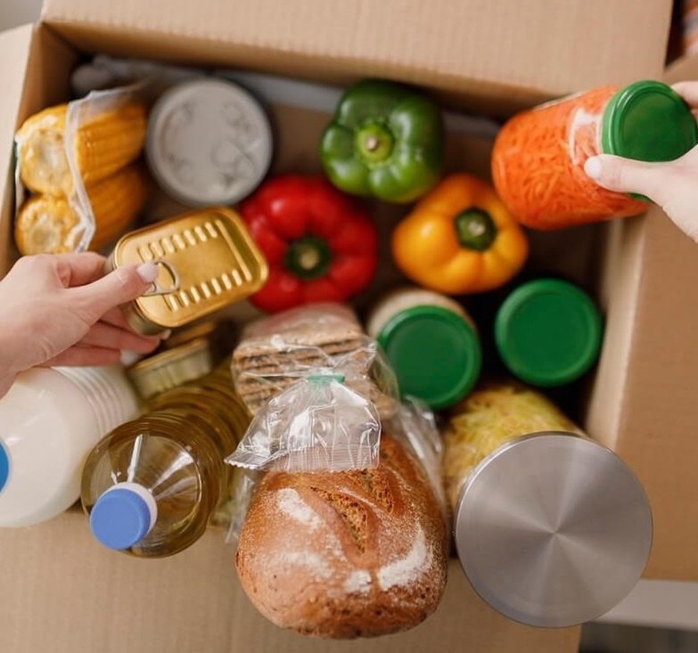 Cardboard box with groceries.