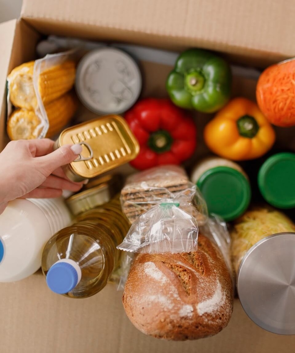 Cardboard box with groceries.