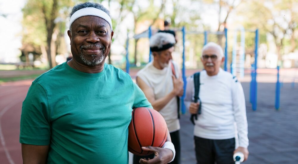 Healthy senior men on the basketball court.