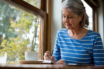 Photo of woman filling out a form.