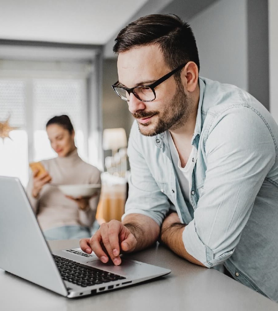 Man looking for information on laptop.