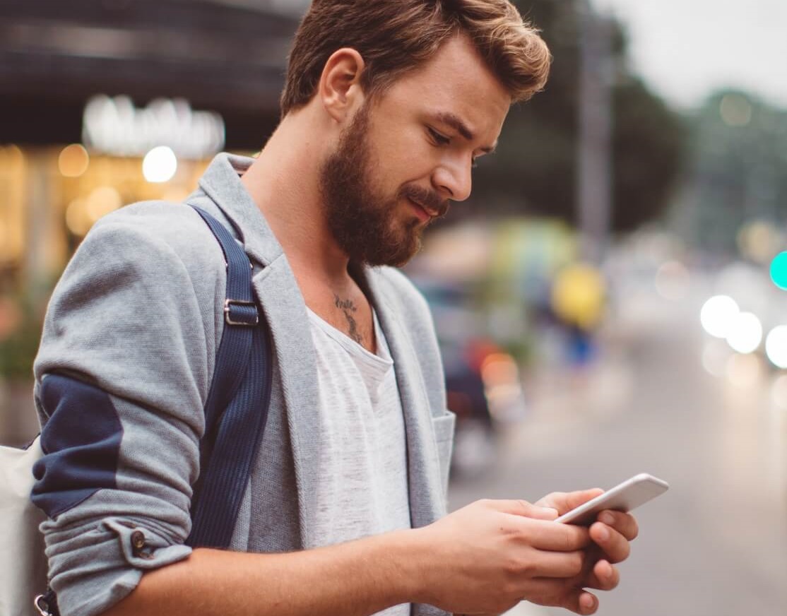 Man using mobile phone.