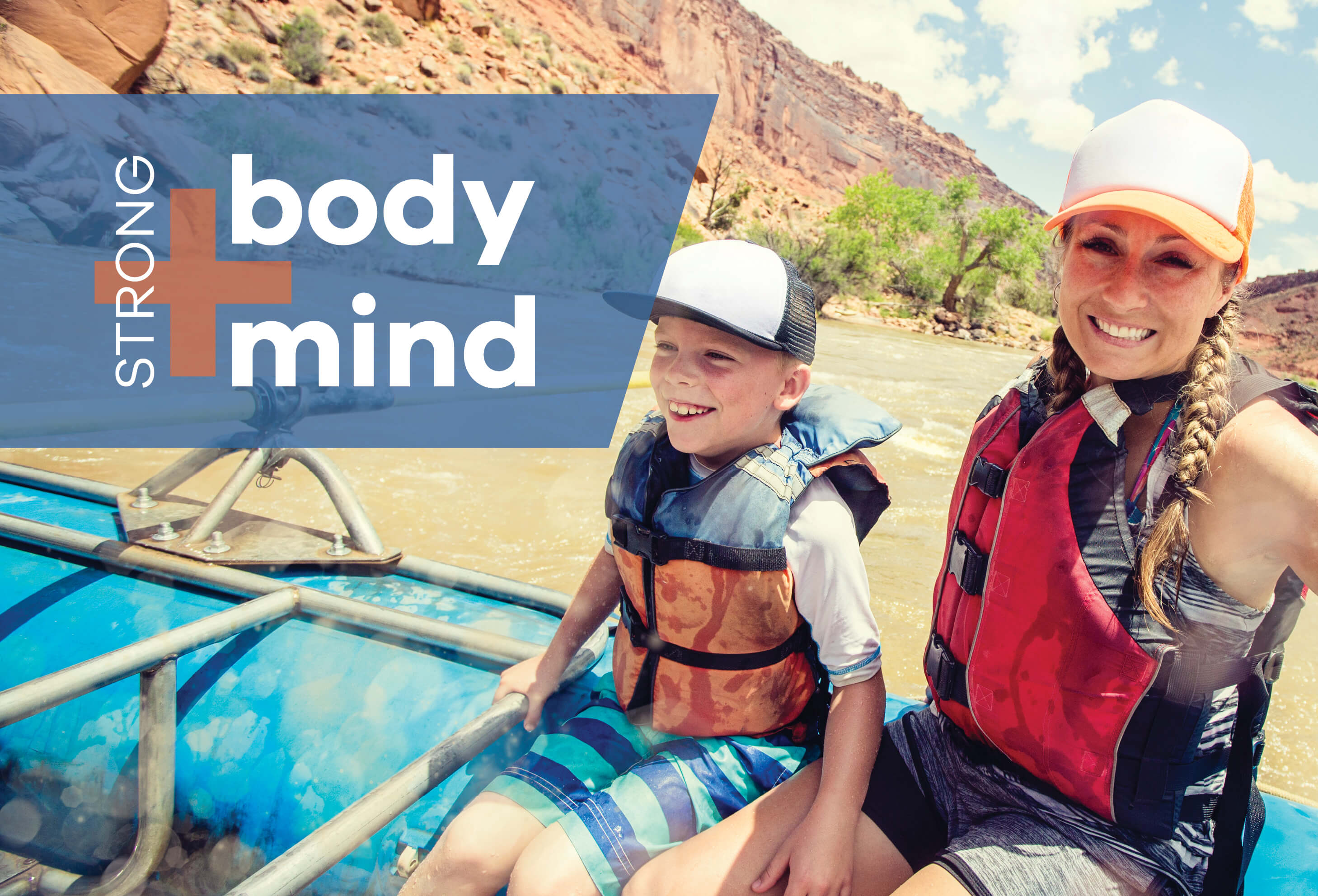 Woman and boy enjoying river raft ride.