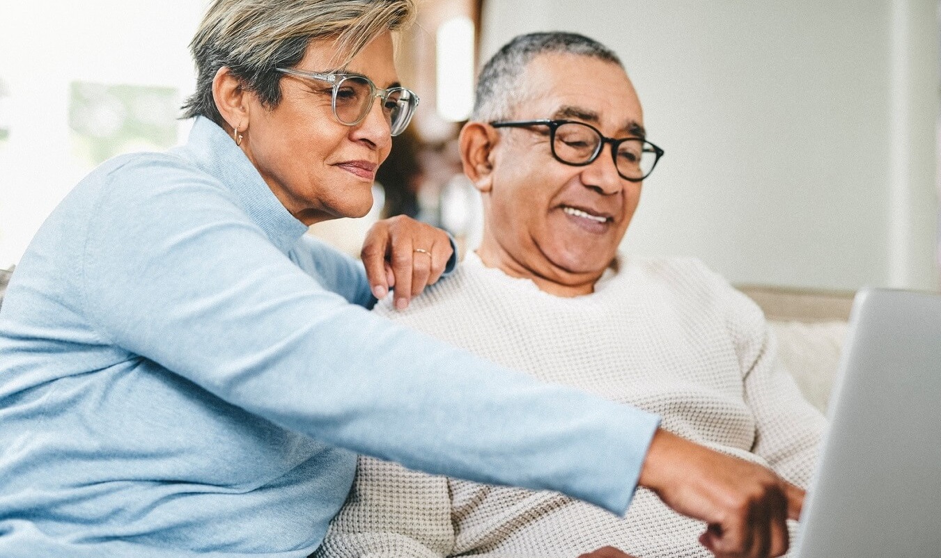 Photo of couple looking at online pharmacy information.