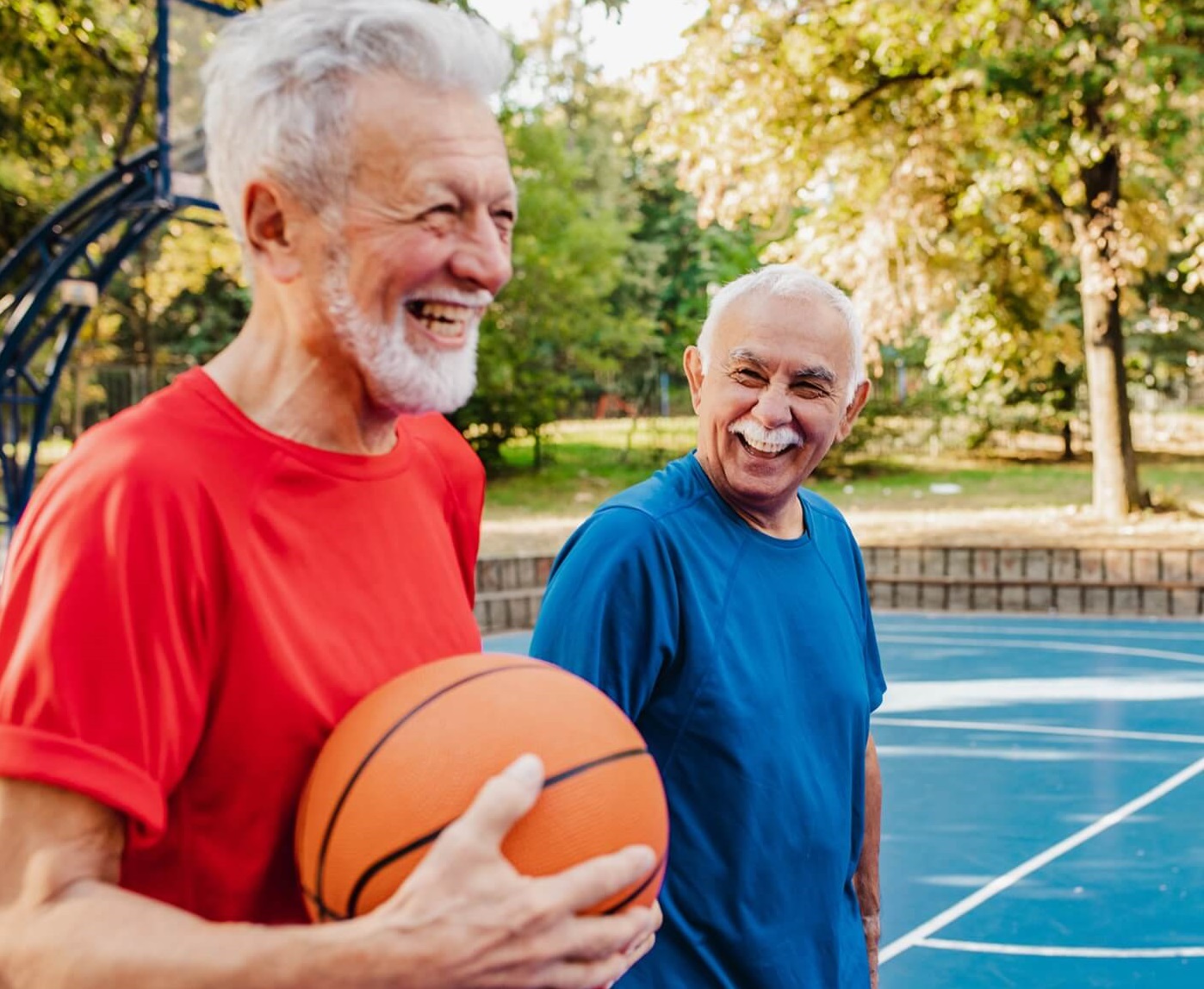 Senior men playing basketball