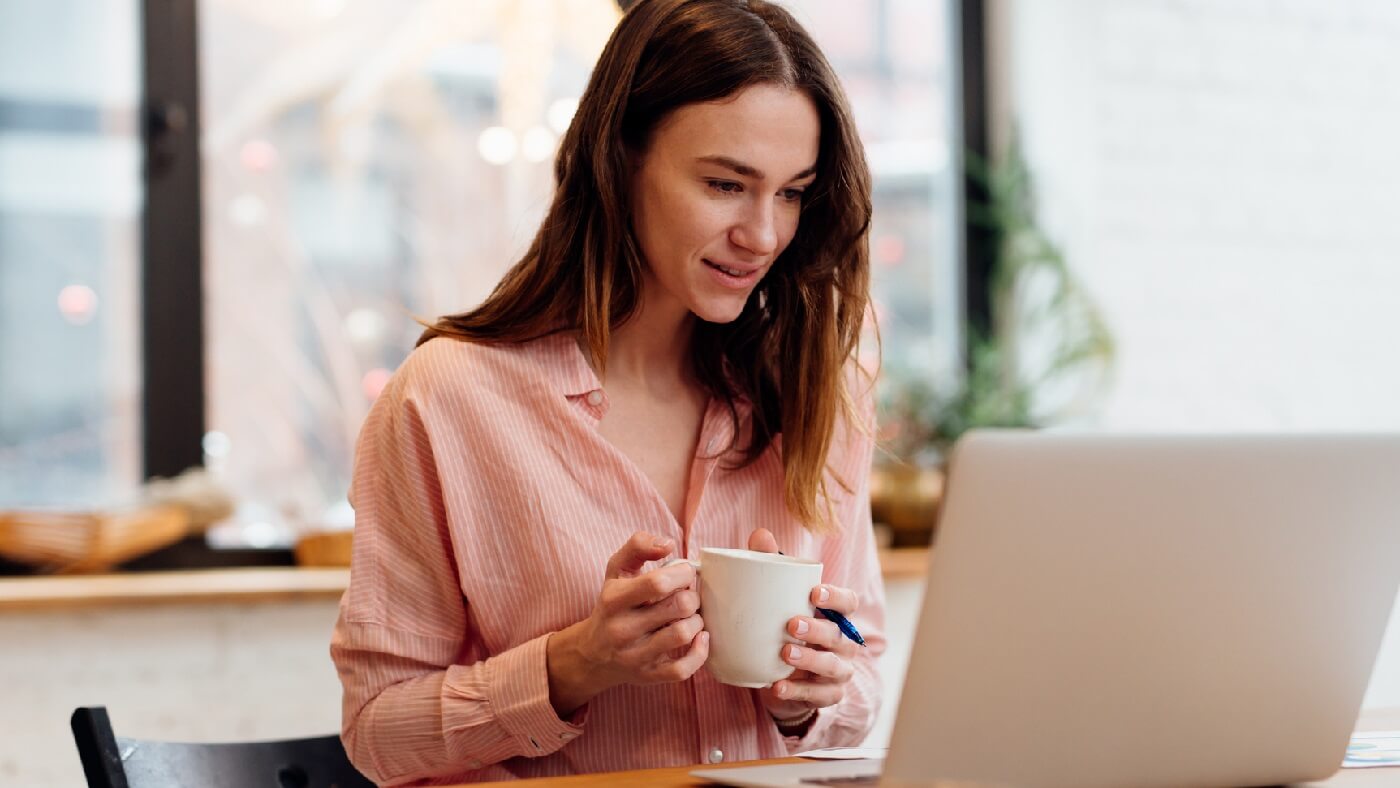 Photo of a woman comparing insurance plans online.