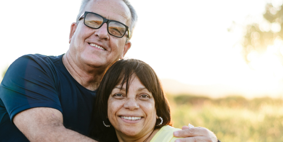 man and woman smiling during an embrace