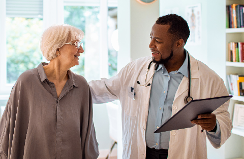 a woman talks to her provider in a doctor's office