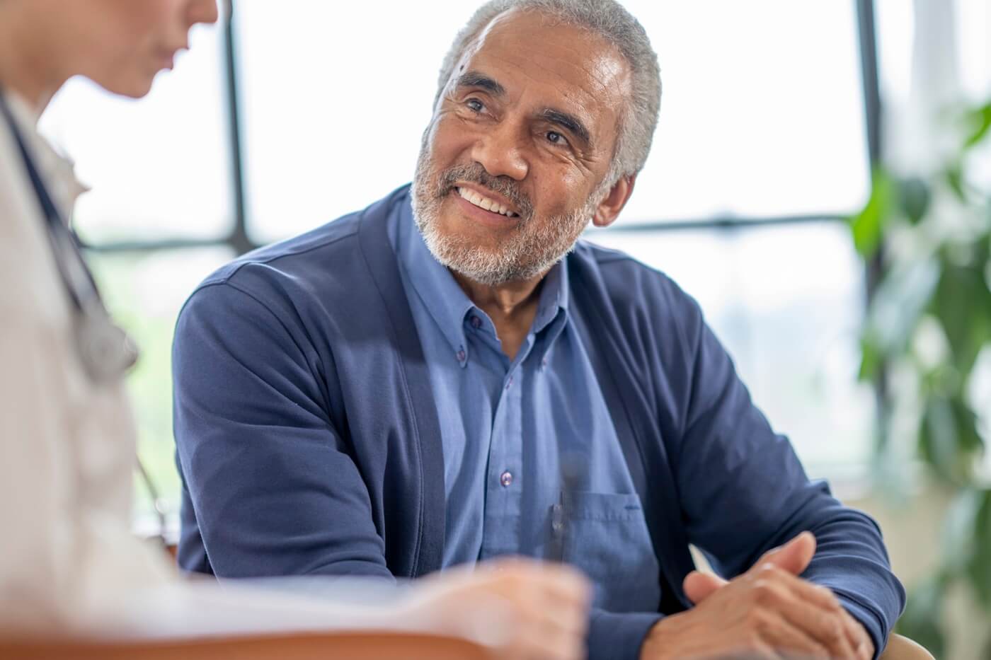 Senior man talking with his doctor