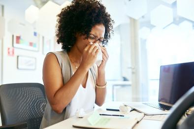 Woman sneezing