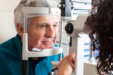 Older man at an eye exam