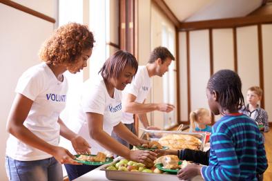 Volunteers serving food