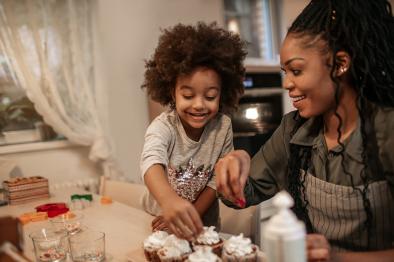 Mother and daughter making cupcakes