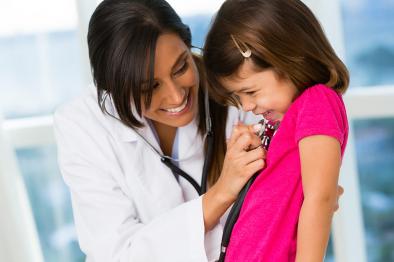 Doctor checking on a small girl