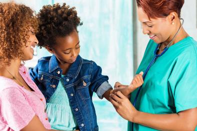 Doctor with mother and daughter