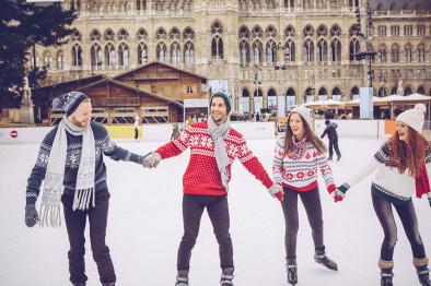 Four people ice skating