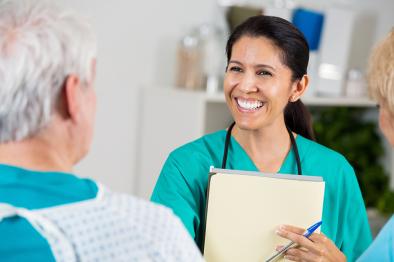 Nurse speaking with elders man