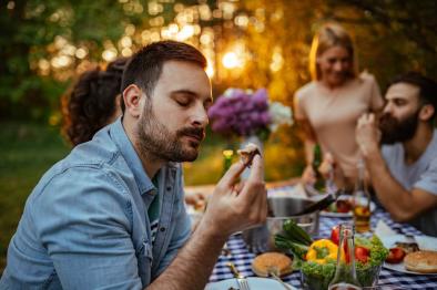 Photo of man savoring his food.