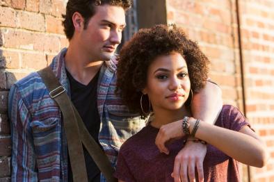 Photo of young couple with their arms around each other.