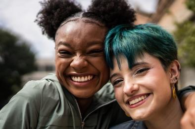 Photo of two smiling people.