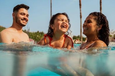 Family enjoying the pool together.