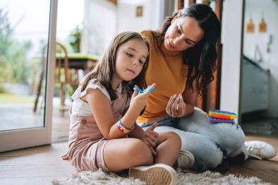Child playing quietly with adult