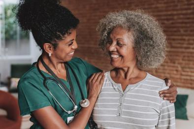 Senior woman with home visit nurse