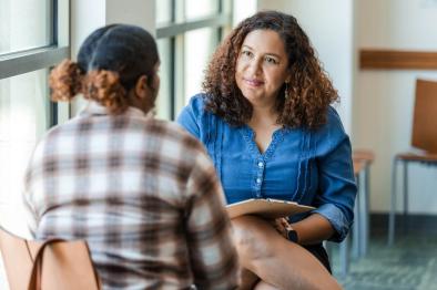 Young adult talking with therapist.