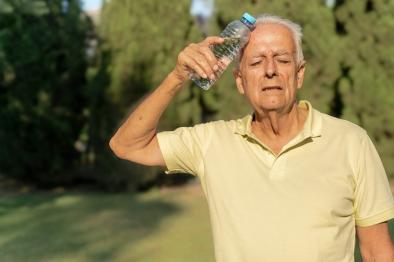 Senior man experiencing heat exhaustion.