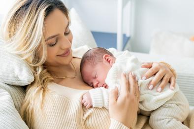 Young mother holding newborn baby