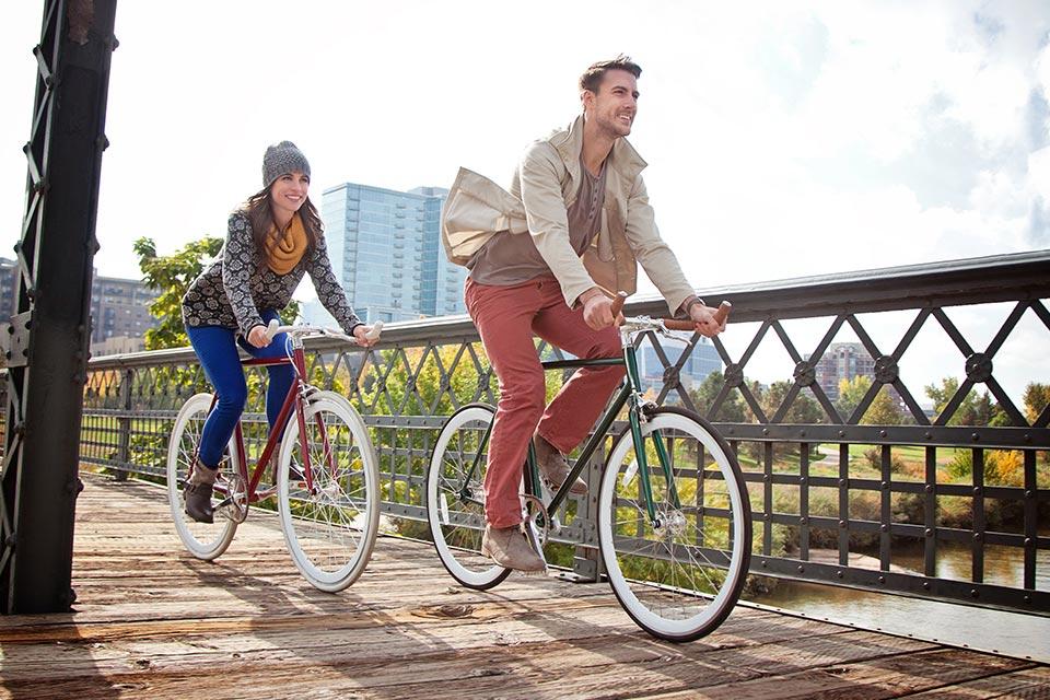 Man and woman biking in Denver