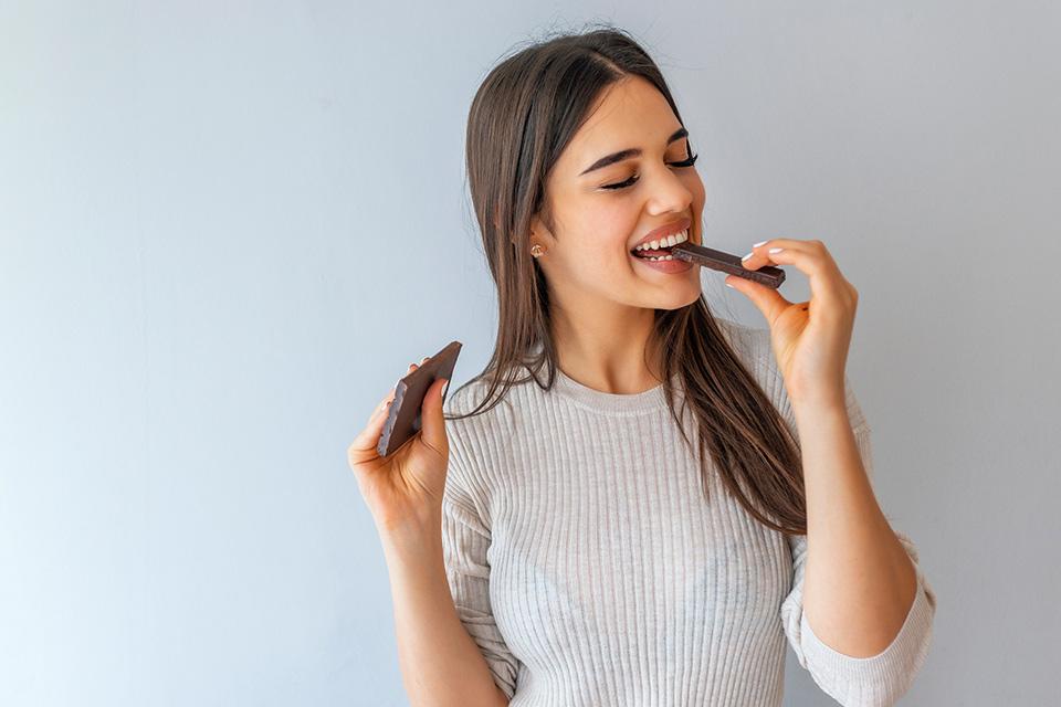 Woman eating chocolate