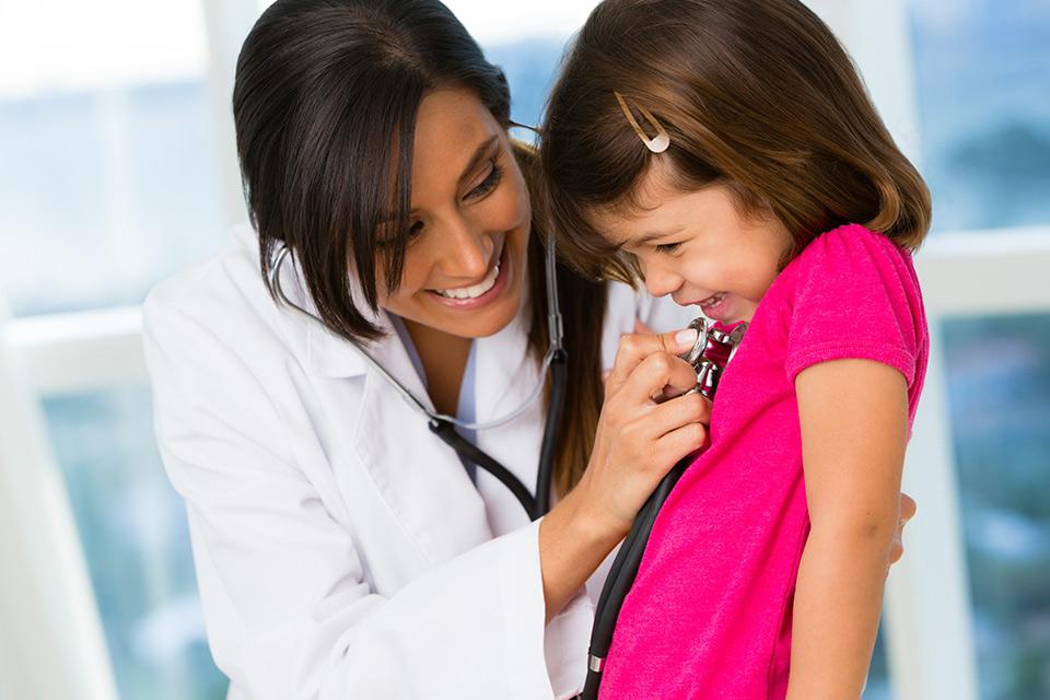 Doctor checking on a small girl