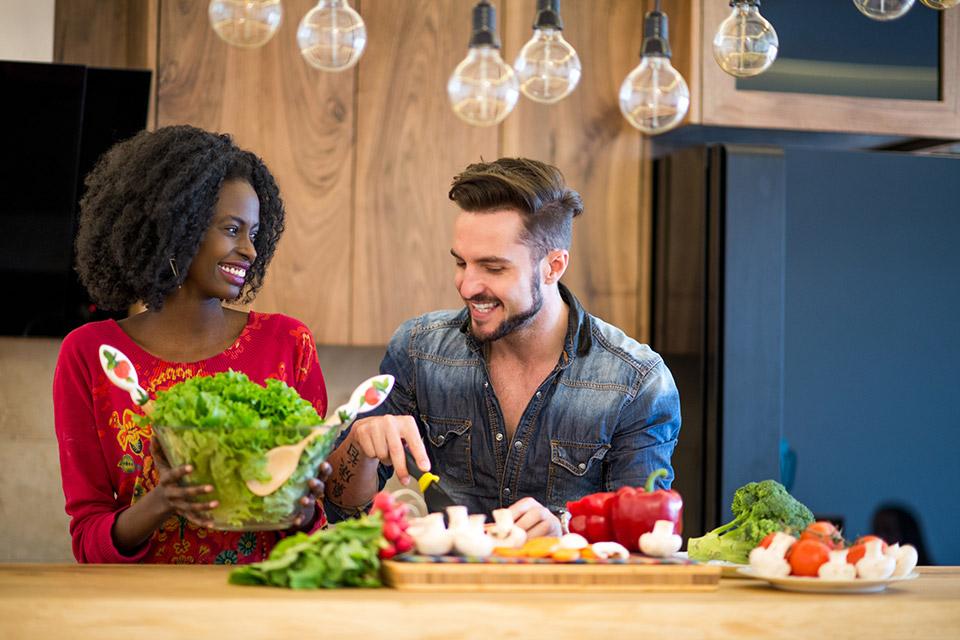 Couple making a salad