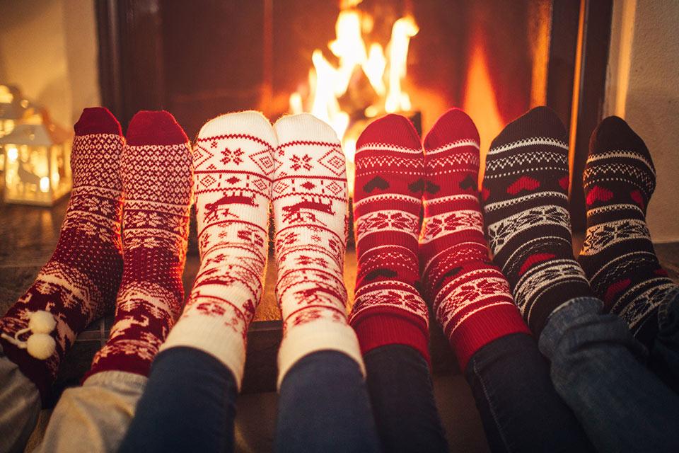 Feet up by a fireplace