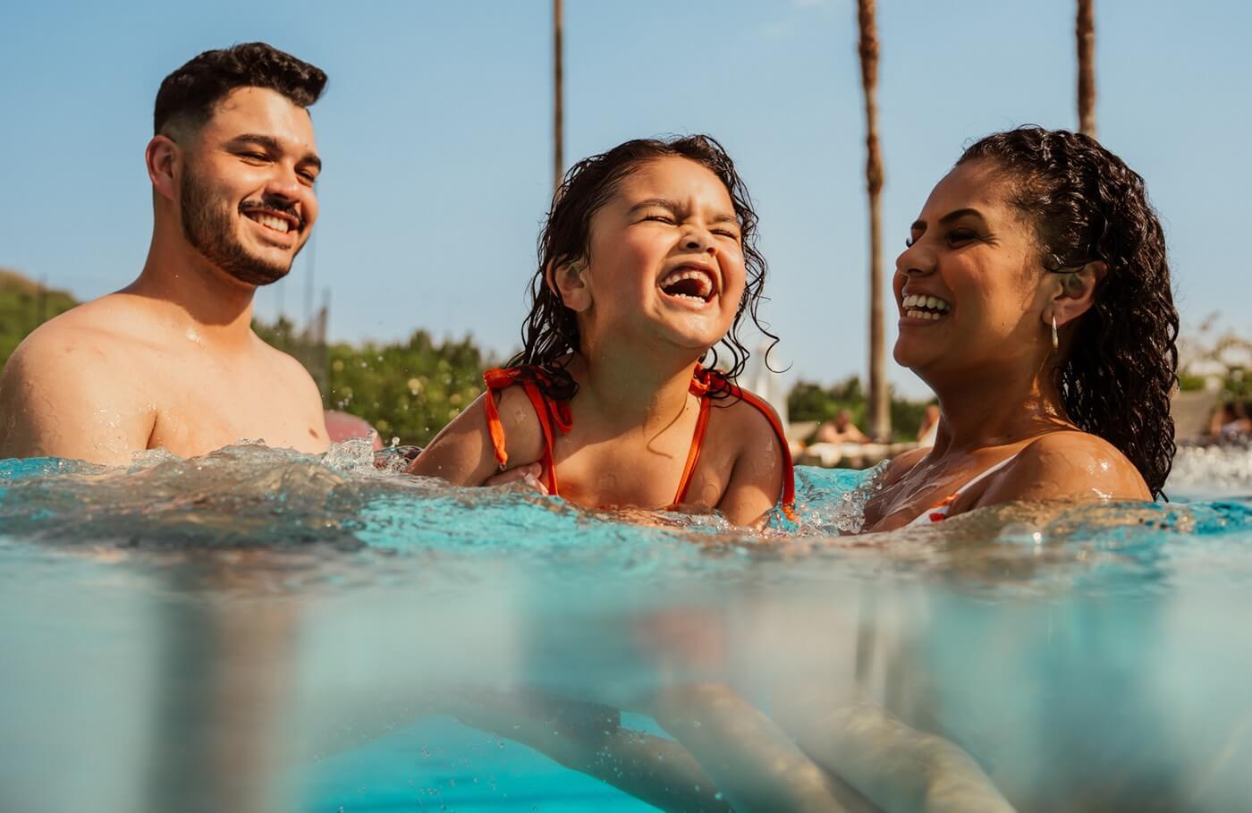 Family enjoying the pool together.